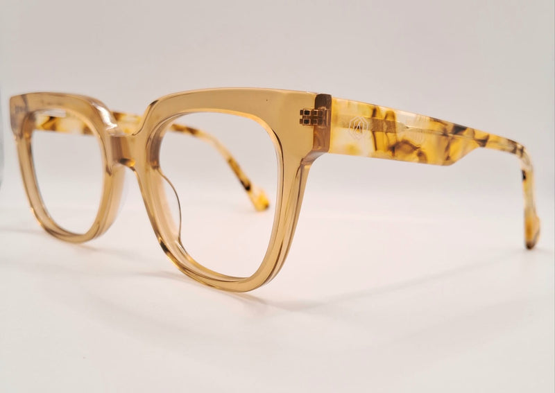 armação em acetato dourado transparente com hastes em animal print- formato quadrado